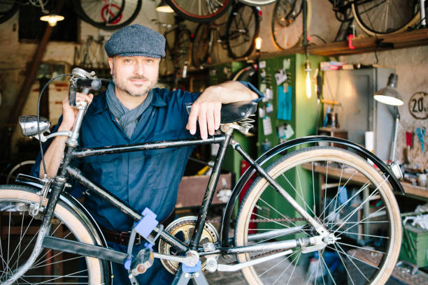 istock Portrait: hobby mechanic in overall in his bicycle workshop 1013043208
