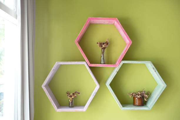 istock Colourful shelves with dried flowers site the window 1013043406
