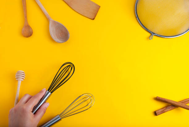 istock Tools pastry kitchen utensile for cooking dessert, over yellow background with copy space, still life. Top view. 1013044096