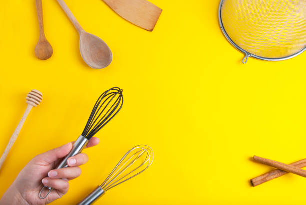 istock Tools pastry kitchen utensile for cooking dessert, over yellow background with copy space, still life. Top view. 1013044104