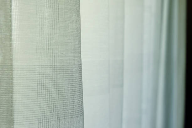 istock White Curtain in House for Sunlight Protection, Selective Focus in Front 1013058716