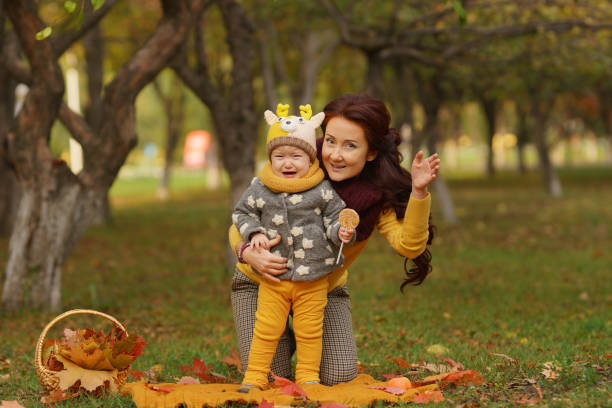istock Family in sunny autumn park 1013064106