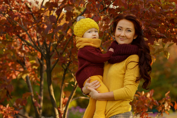 istock Family in sunny autumn park 1013064142