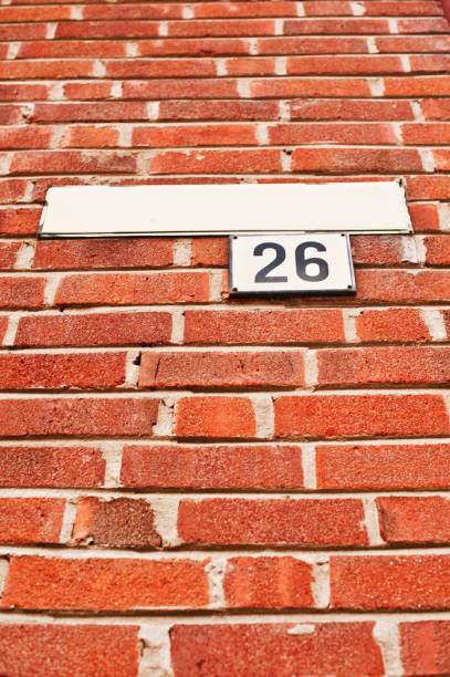 istock House Number 26 Tag On Red Brick Wall 1013064160