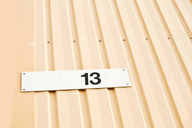 istock House Number 13 Tag On Yellow Wall 1013064268