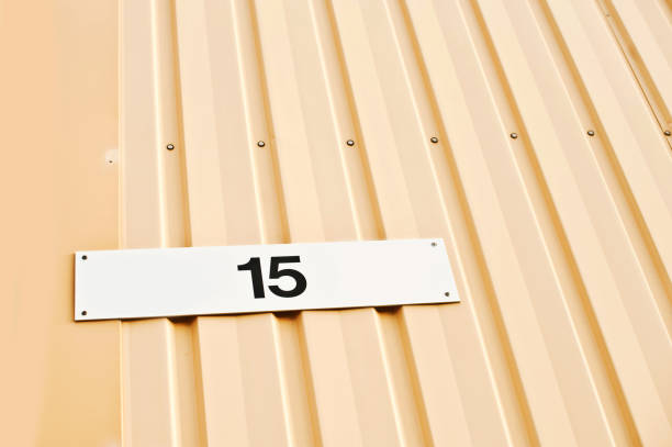 istock House Number 15 Tag On Yellow Wall 1013064814