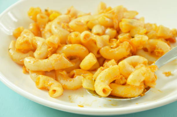 istock stir fried macaroni and egg with ketchup scooping in spoon 1013069804
