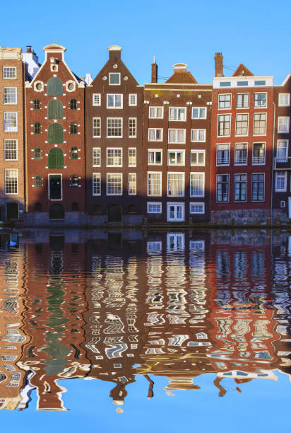 Typical Dutch houses built by the canal, Amsterdam, Netherlands