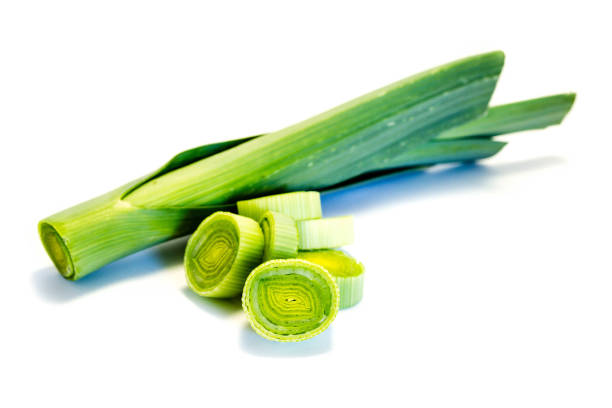 istock Green whole leek an leek slices isolated on white background 1013070962