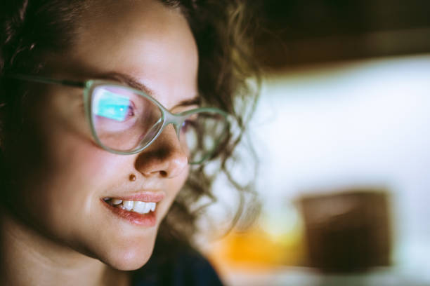 istock Woman eyeglasses reflecting laptop screen 1013073744