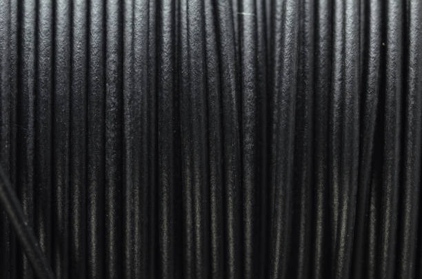 istock Close up of electric wires on vertical lineup 1013077920
