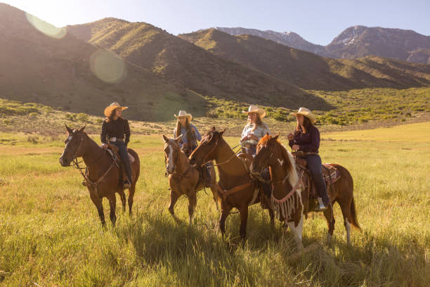 cowgirls cowboys riding horses at countryside of santaquin valley of Salt lake City SLC Utah USA cowgirls cowboys riding horses at countryside of santaquin valley of Salt lake City SLC Utah USA spanish fork utah stock pictures, royalty-free photos & images