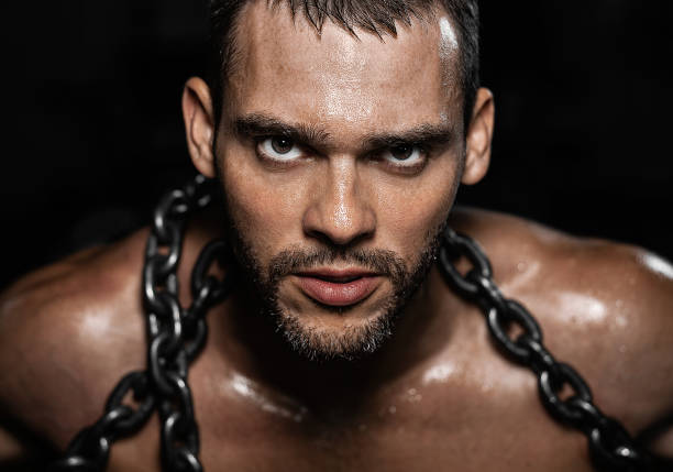 istock Portrait of a man in chains 1013100096