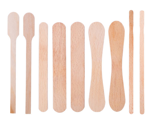 istock Wooden ice-cream sticks isolated on white background 1013125560