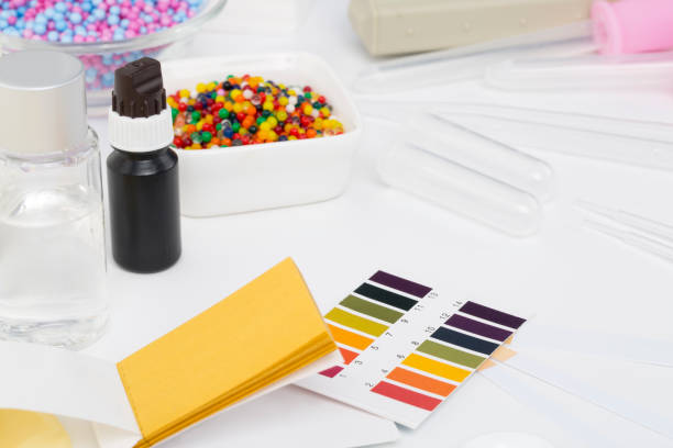 istock Cosmetic ingredients safety testing tools, pH value, water powder value, moisture degree, pH test paper, dropper, chemical solvent, and rubber gloves in white background 1013126168
