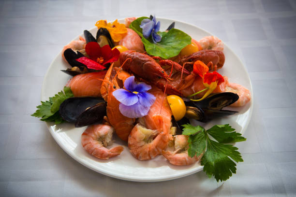 istock salad with boiled crayfish and shrimp with fruit on a plate on a table with a white tablecloth 1013147920