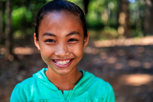 Portrait of happy Cambodian girl, Cambodia Portrait of happy Cambodian girl in village near Siem Reap, Cambodia cambodian ethnicity stock pictures, royalty-free photos & images