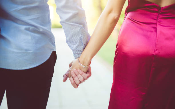istock Stylish young couple holding hands and walking. 1013158914