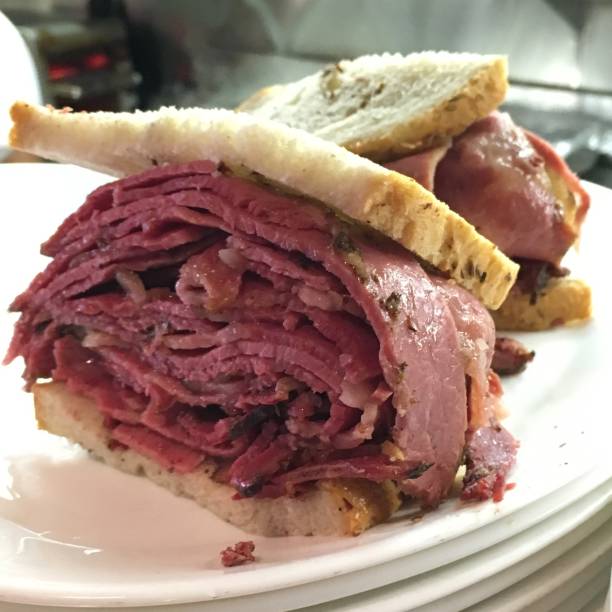 Pastrami on rye A pastrami on rye sandwich is prepared and ready to be eaten pastrami photos stock pictures, royalty-free photos & images