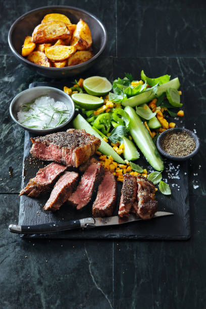 istock French pepper steak (Steak au Poivre) with fresh vegetables and herbs 1013169224