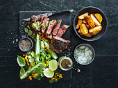 French pepper steak (Steak au Poivre) with fresh vegetables and herbs