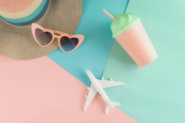 istock Women's accessories items on pastel colors background, Summer vacation concept 1013172670