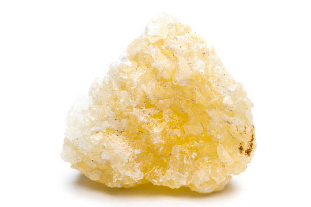 Yellow calcite mineral isolated on white background Yellow calcite mineral isolated on white background calcite stock pictures, royalty-free photos & images