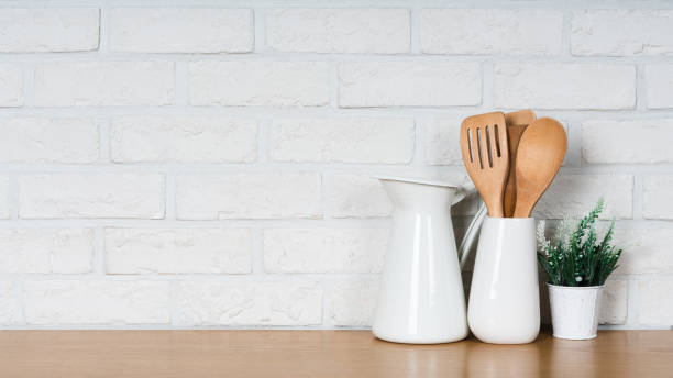 istock There are various cookers on the table, background made of bricks painted white color only. 1013182724