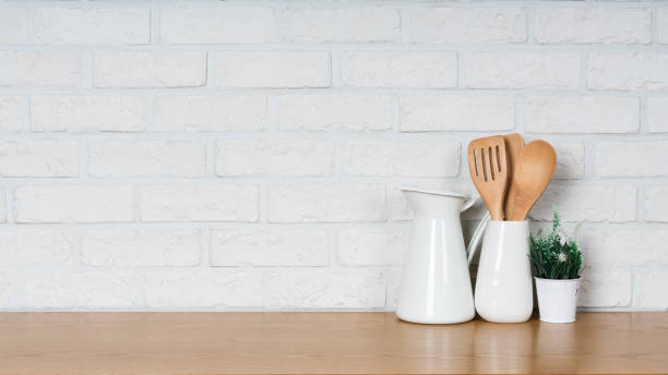 istock There are various cookers on the table, background made of bricks painted white color only. 1013182734
