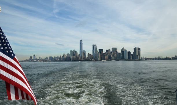 istock New York City skyline with flag 1013184592