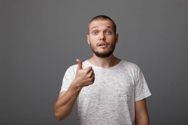 istock young man showing a thumbs up gesture 1013196466