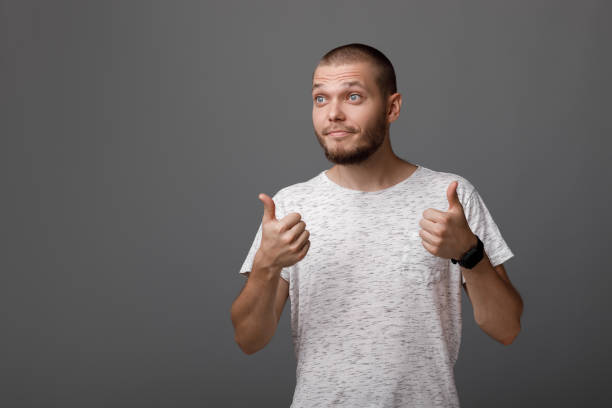 istock young man showing a thumbs up gesture 1013198270