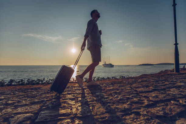 istock Tourist walking by the sea 1013202056