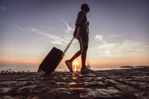 istock Tourist with luggage 1013202274