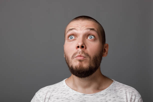 istock portrait of surprised young man 1013204686