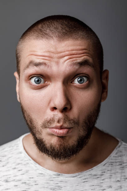 istock portrait of surprised young man 1013204774