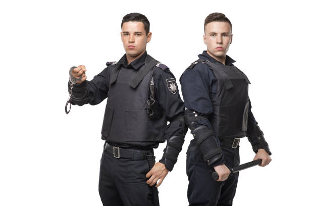istock Special force troops with a baton and handcuffs 1013208134