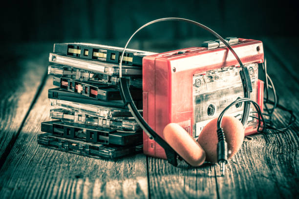 Classic cassette tape with headphones Classic cassette tape with headphones personal stereo stock pictures, royalty-free photos & images