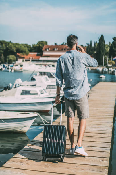 istock Tourist man on pier 1013213110
