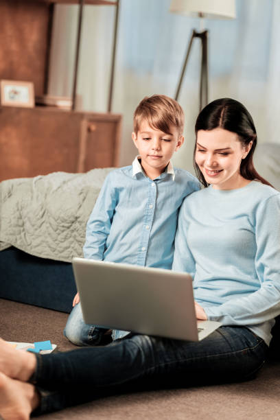 istock Joyful nice woman holding a laptop 1013213642