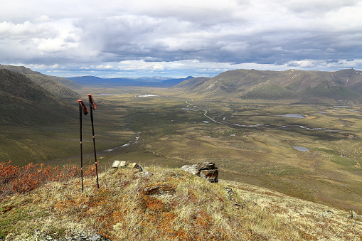 Hiking in the northern part of Tombstone Territorial Park. Dempster Highway winding through the valley. Yukon Territory, Canada