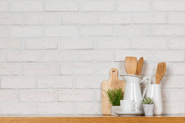 istock There are various cookers on the table, background made of bricks painted white color only. 1013229098