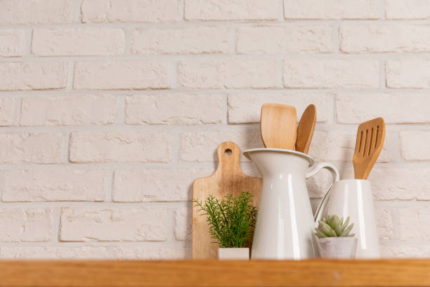 istock There are various cookers on the table, background made of bricks painted white color only. 1013229122
