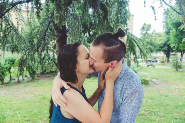 istock Couple kissing in the rain 1013234322