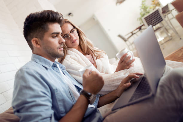 istock Cheerful young couple enjoying at home 1013241708