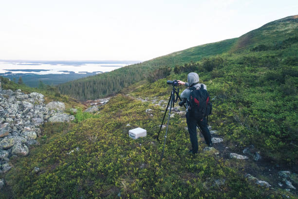 istock Photographer is Shooting in the Mountains 1013264648