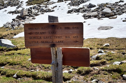 Continental Divide Trail sign in Wind Rivers Range Wyoming along Continental Divide Trail No. 094, Fremont Crossing, Seneca Lake, Lester Pass, Island Lake and Indian Lake which is part of the Rocky Mountains in the United States.