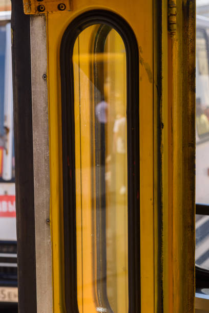 istock Door in a yellow Soviet Russian old fashioned passenger bus. 1013268162