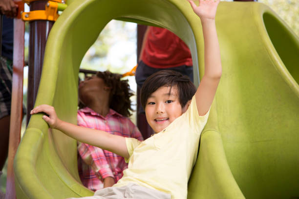 istock Multi-ethnic group of school children playing on school playground. 1013268256