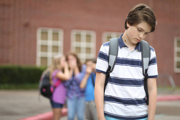 istock Pre-adolescent boy being bullied at school. 1013272870